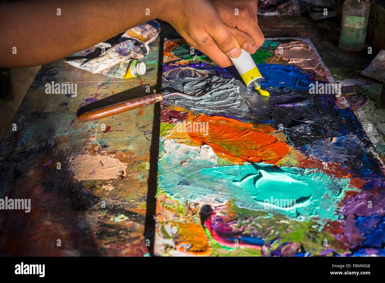Mid adult man, creating artwork, close-up Stock Photo