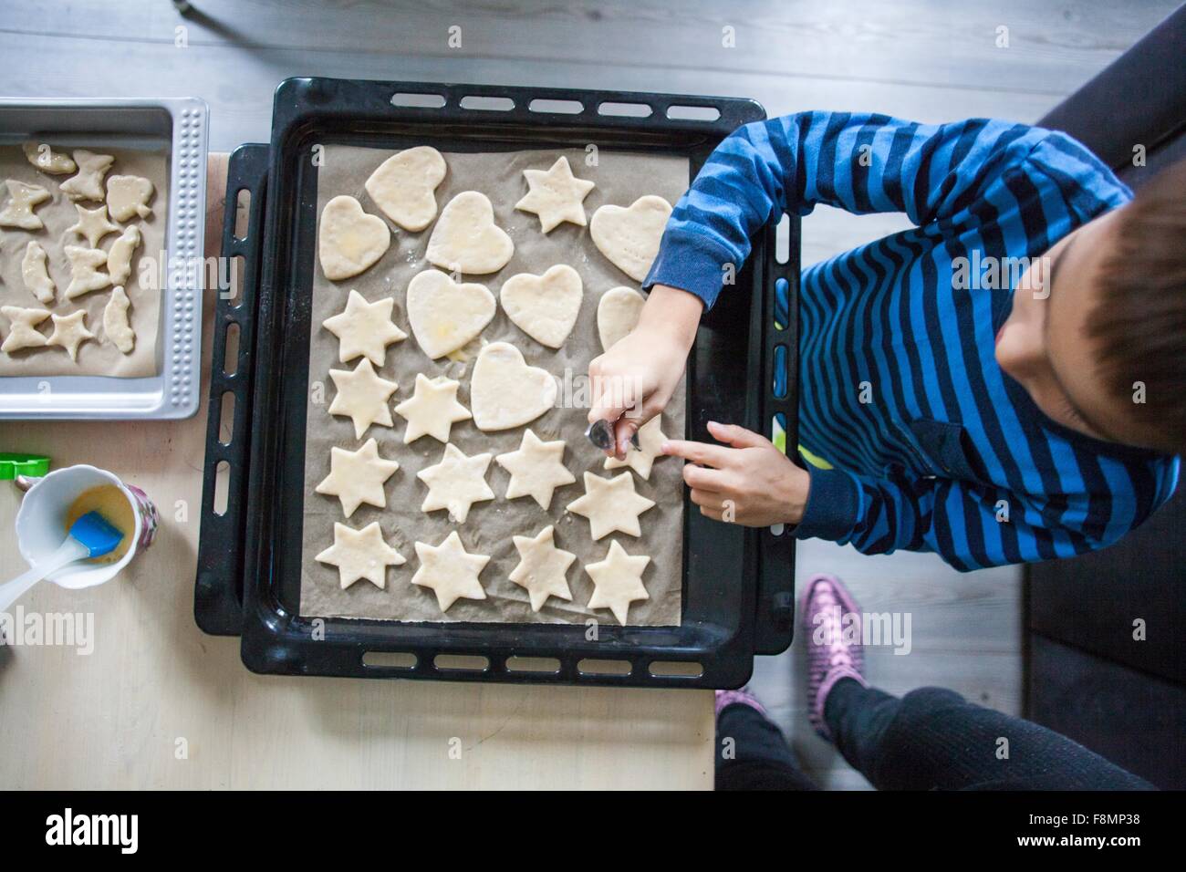 Young boy making cookies, overhead view Stock Photo