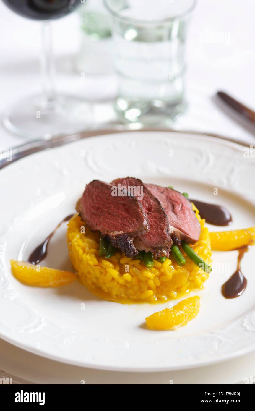 Beef steak on safron rice Stock Photo