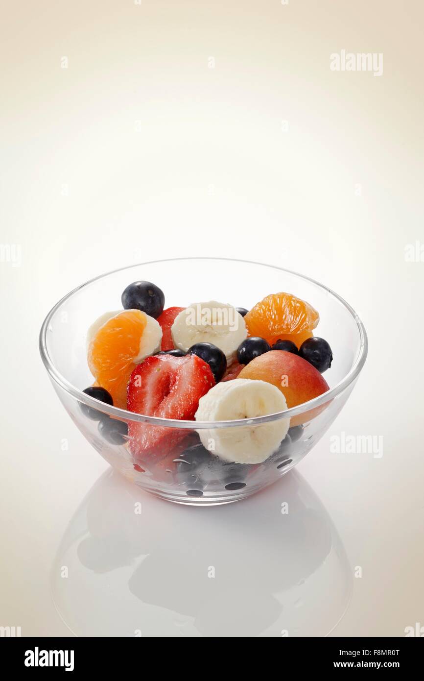 Fruit salad in a glass bowl Stock Photo - Alamy