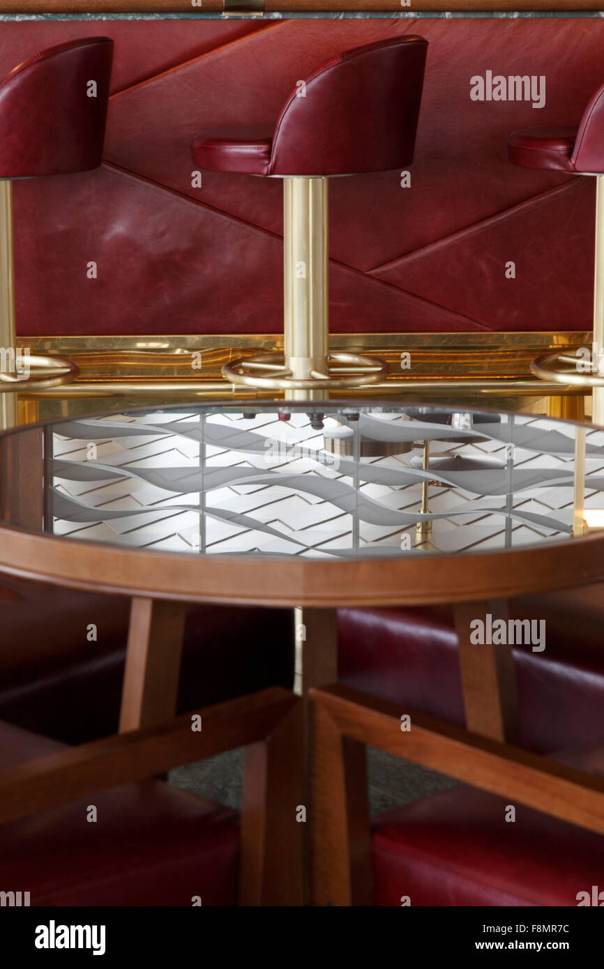 Waldorf Astoria Hotel. Reflection in mirrored table top. Bar stools