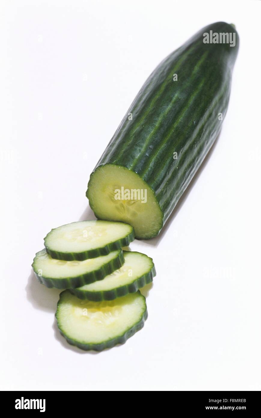 A cucumber, partly sliced Stock Photo