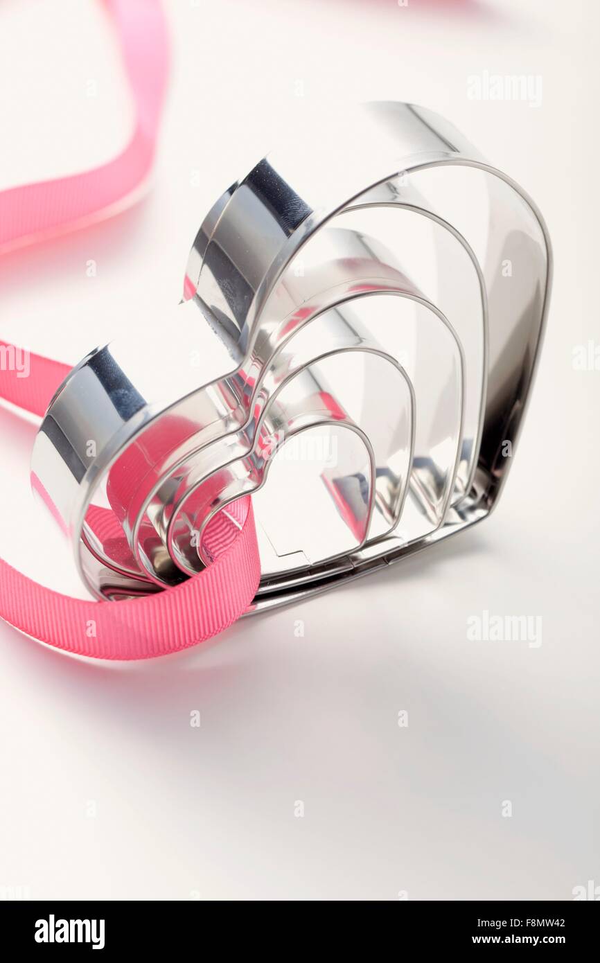 Heartshaped baking tins in various sizes Stock Photo Alamy