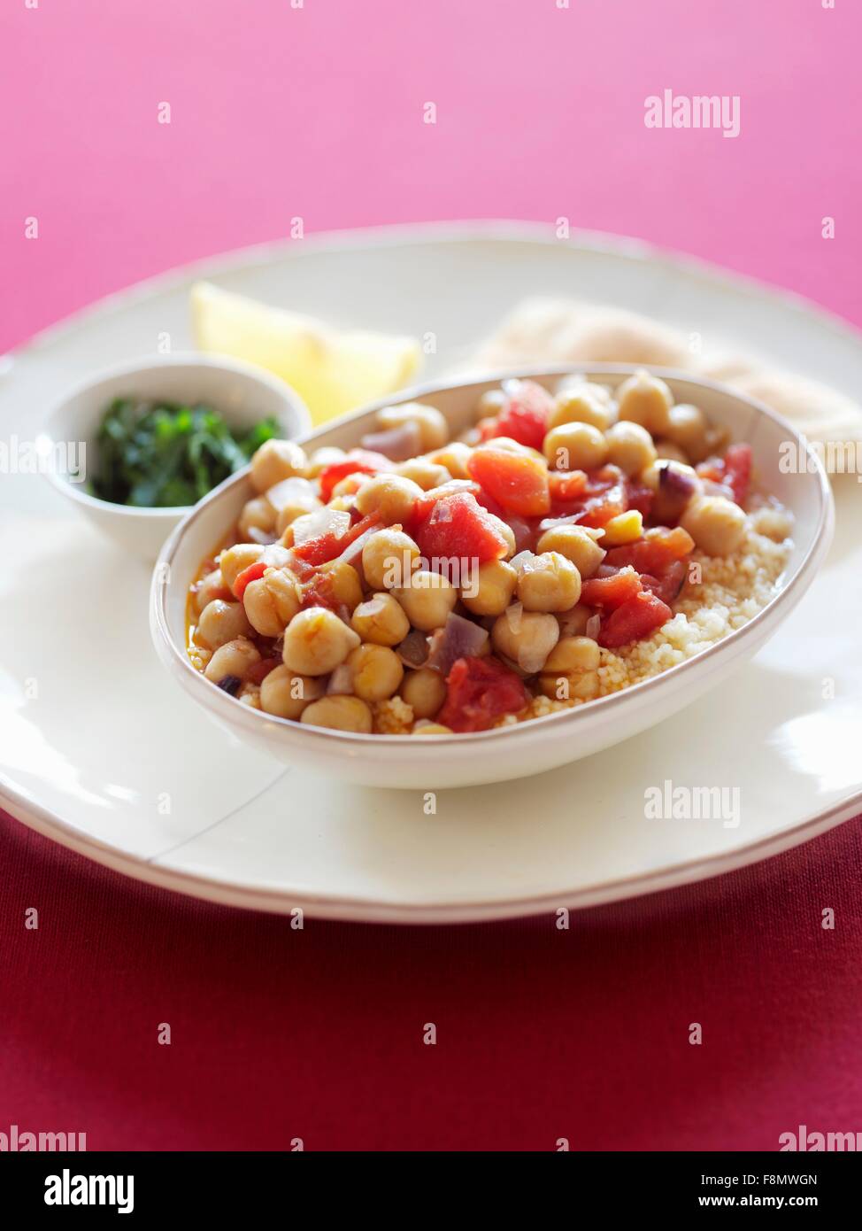 Couscous with chickpeas and tomatoes Stock Photo Alamy