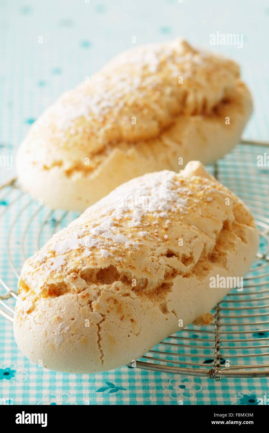 Fresh meringues with icing sugar Stock Photo Alamy