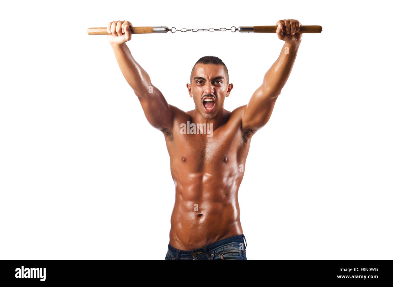 Man in martial arts concept with nunchucks Stock Photo Alamy