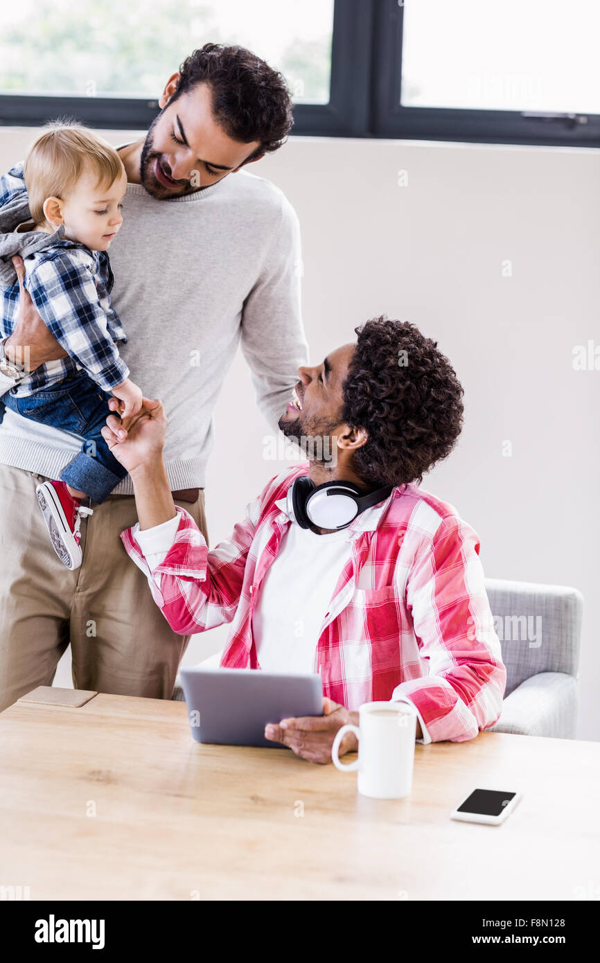 Happy gay couple with child Stock Photo