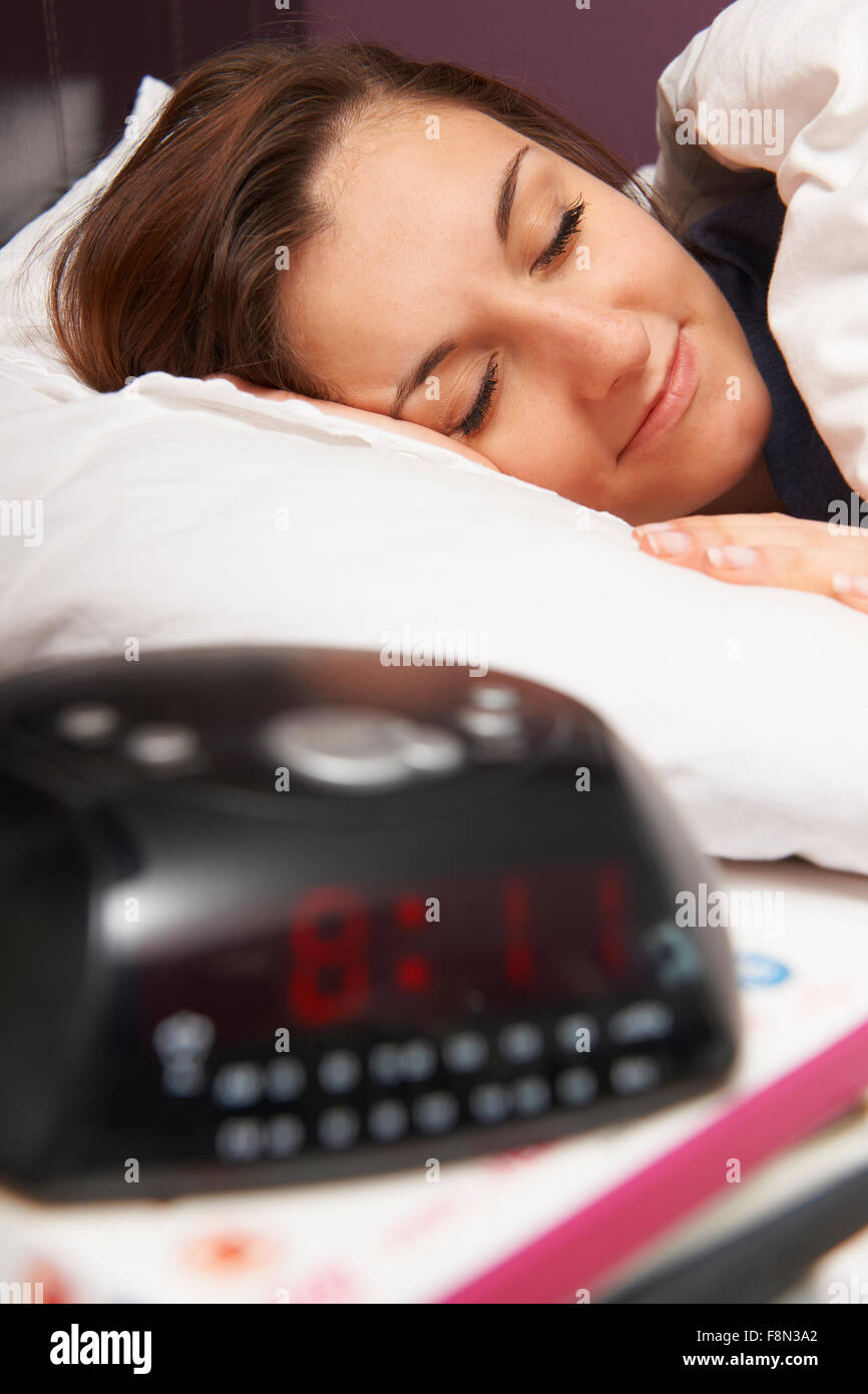 Teenage Girl Sleeping Through Alarm Stock Photo Alamy