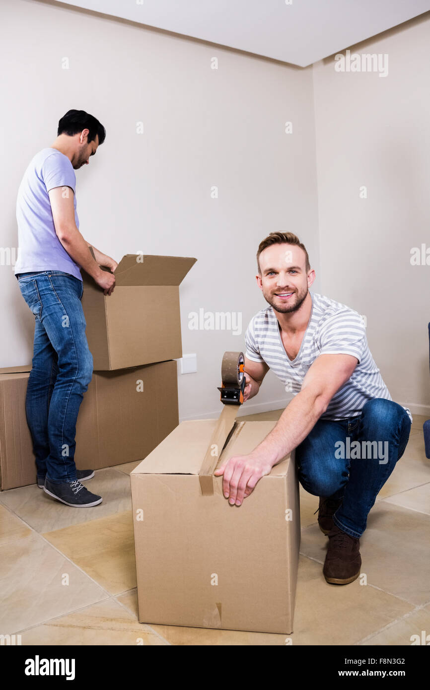 Gay couple moving into new home Stock Photo