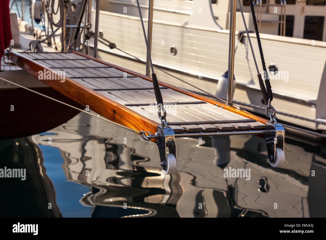 wooden gangway on marine yacht staying in port. luxury tourism Stock Photo