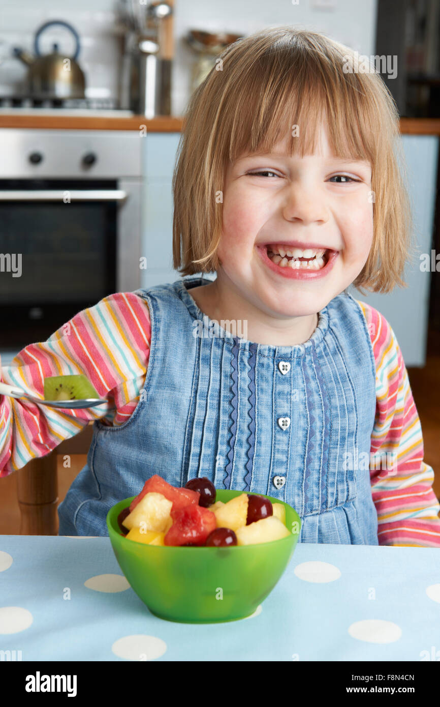 Young Girl Enjoying Bowl Of Fresh Fruit For Pudding Stock Photo Alamy