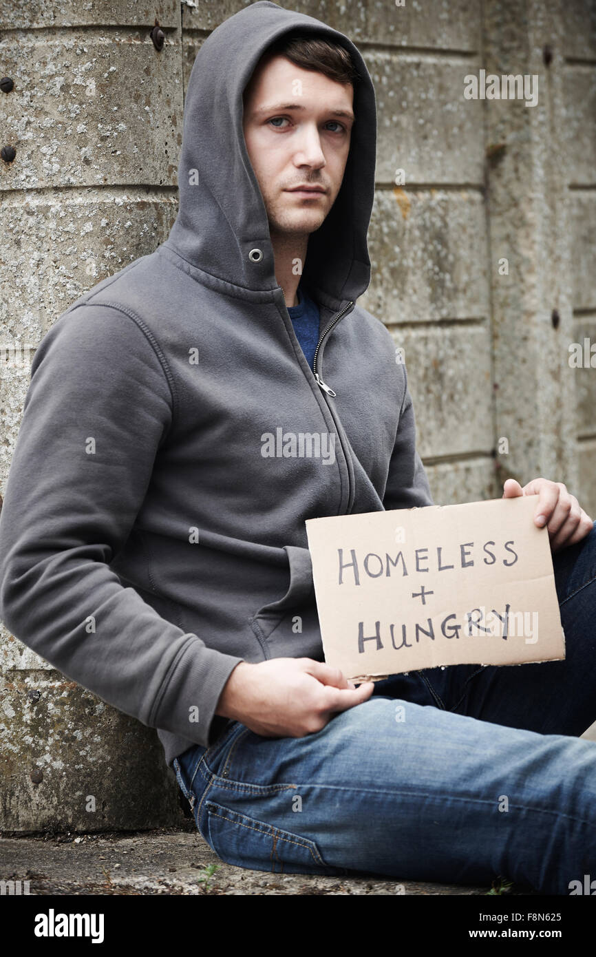 Homeless Young Man Begging On Street Stock Photo
