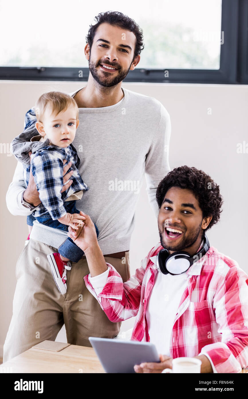 Happy gay couple with child Stock Photo