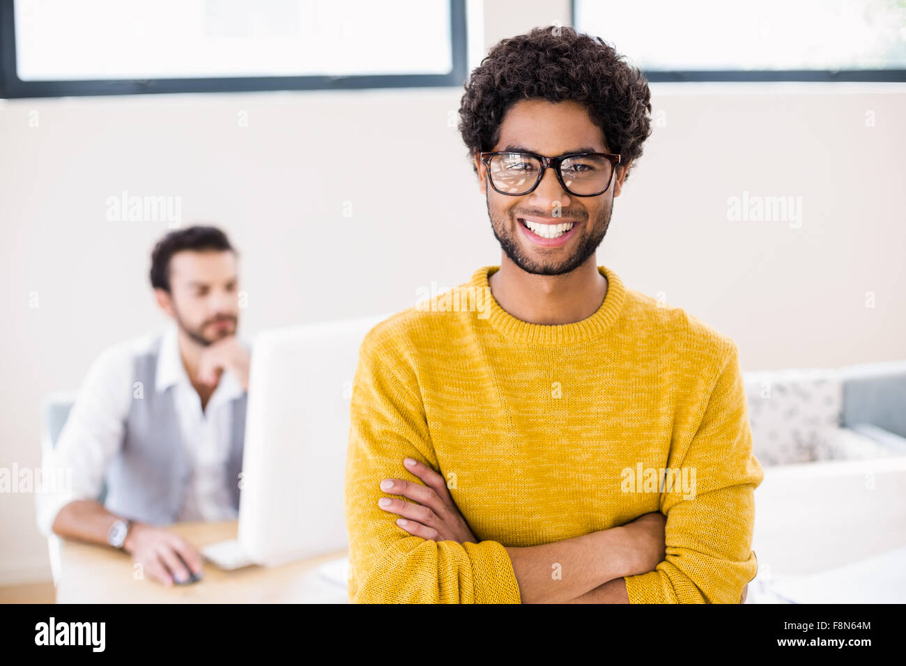 Portrait of smiling man with arms crossed Stock Photo - Alamy