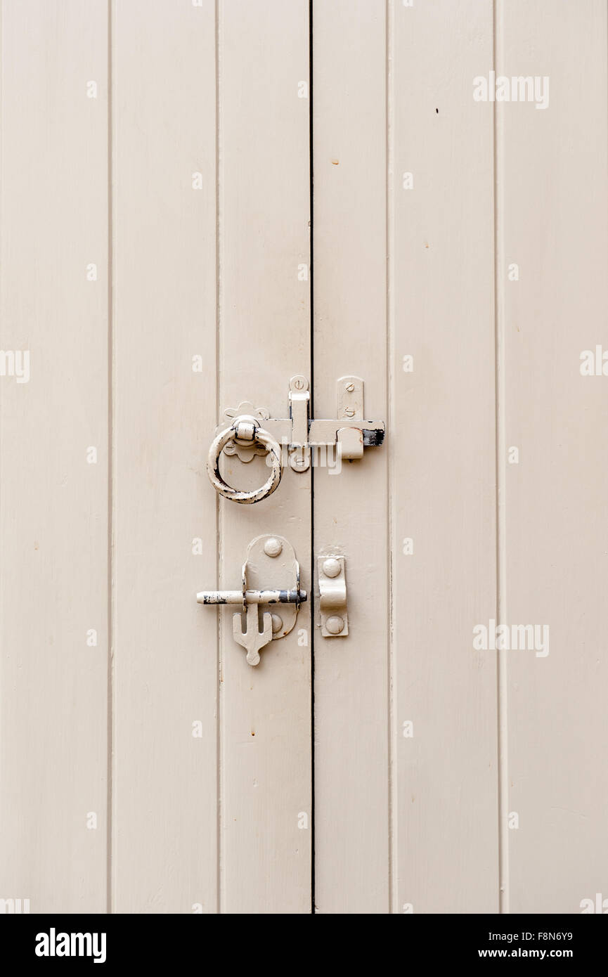 outside white door with lock and bolt Stock Photo