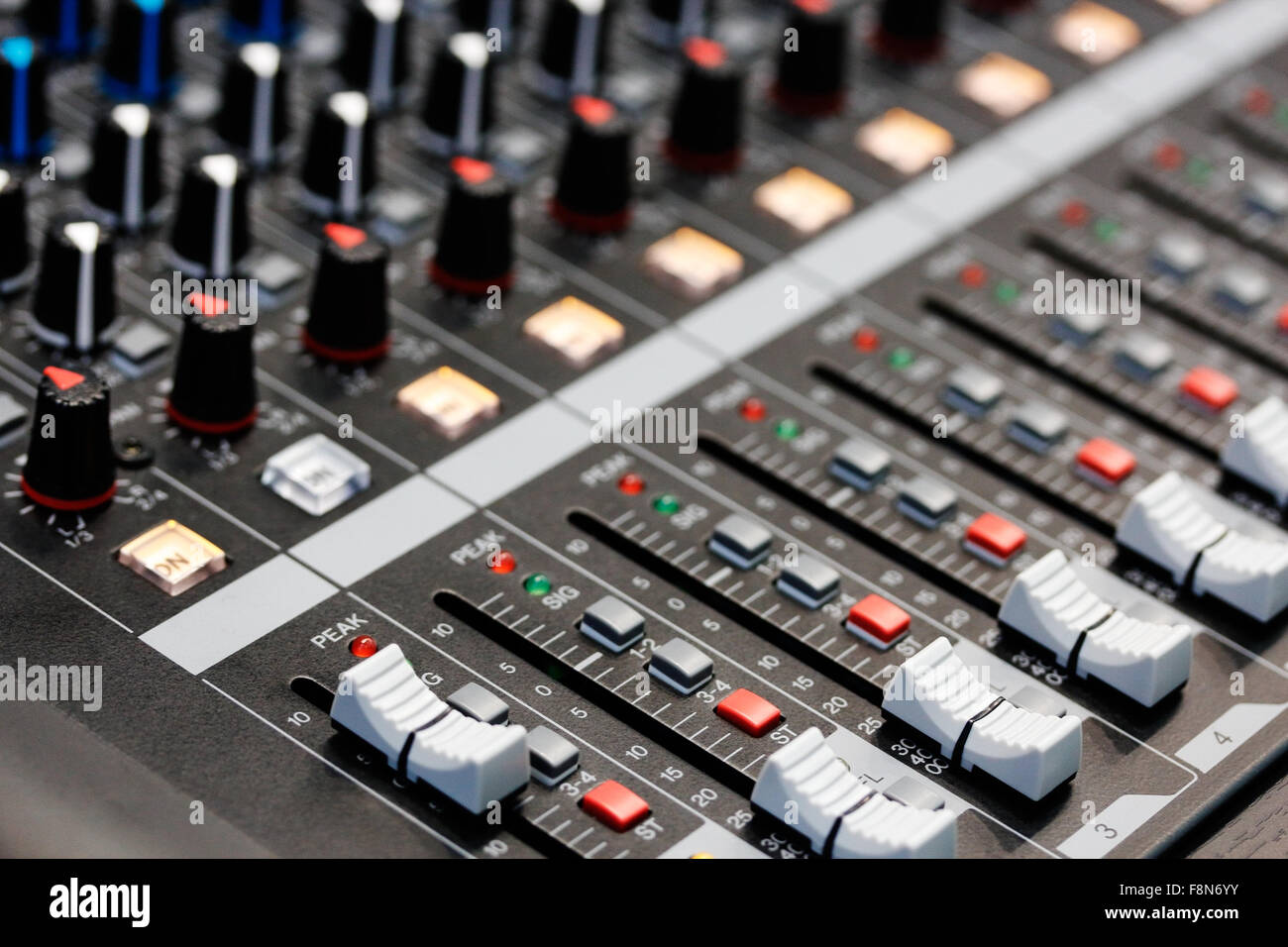 Sound mixing desk. Close up view. Shallow depth of field. Stock Photo