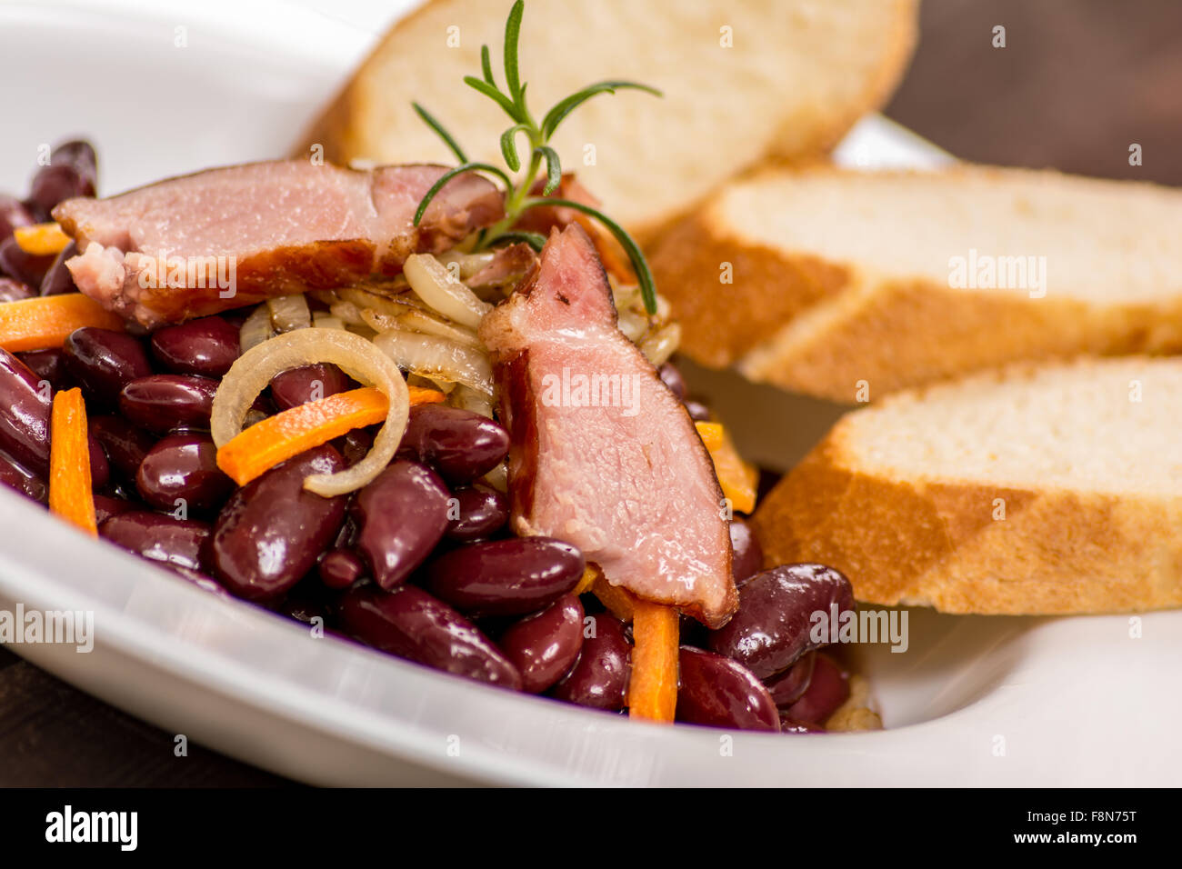 Traditional red beans with meat and vegetables Stock Photo