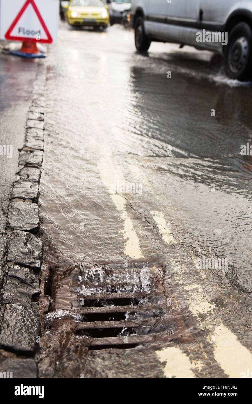 Warning Traffic Sign On Flooded Road With Cars Stock Photo - Alamy