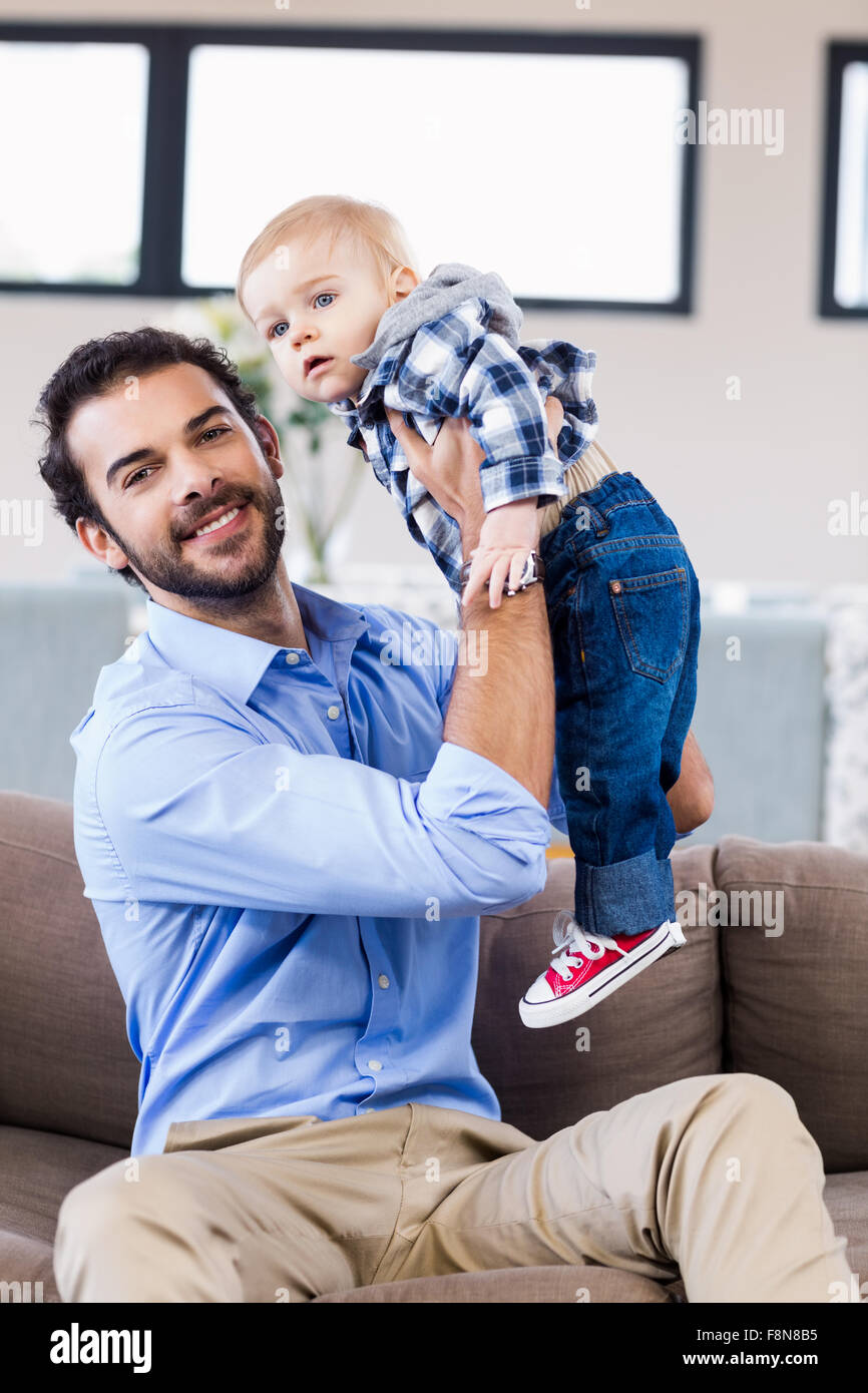 Handsome man playing with child Stock Photo