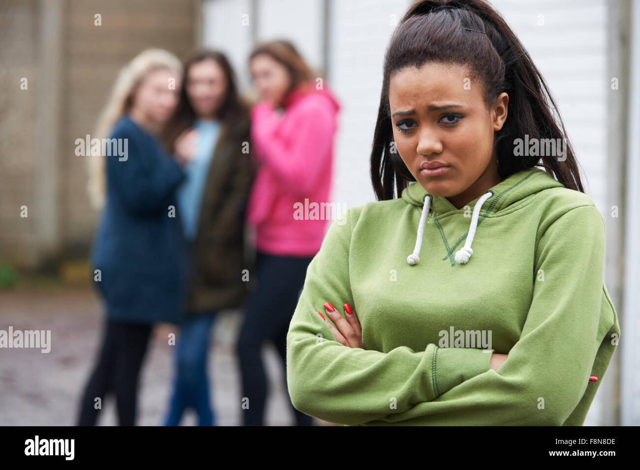 Unhappy Teenage Girl Being Talked About By Peers Stock Photo Alamy