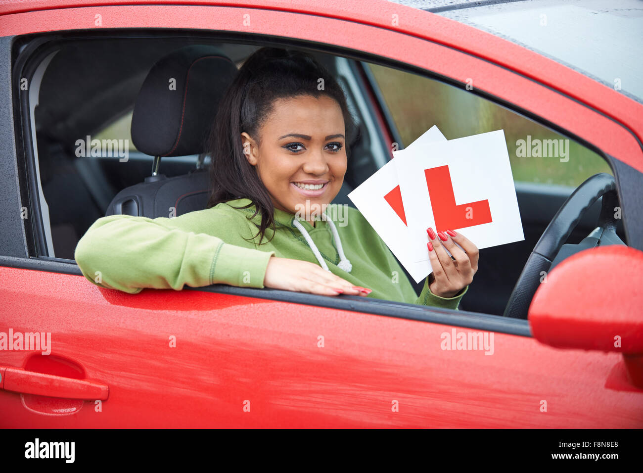 Teenage Girl Passing Driving Exam Stock Photo