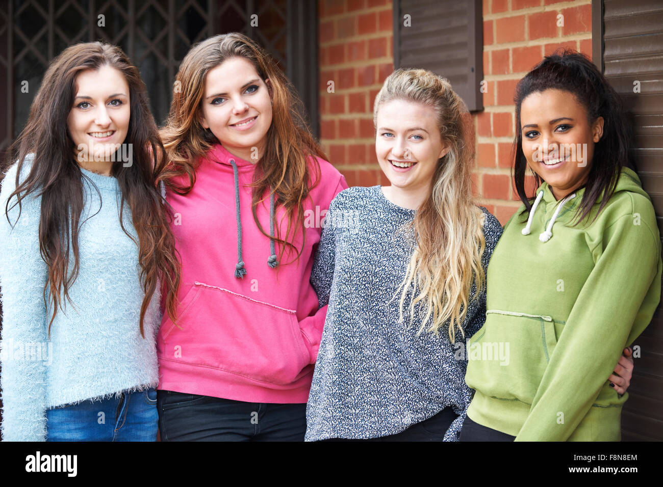 Group Of Teenage Female Friends In Urban Setting Stock Photo