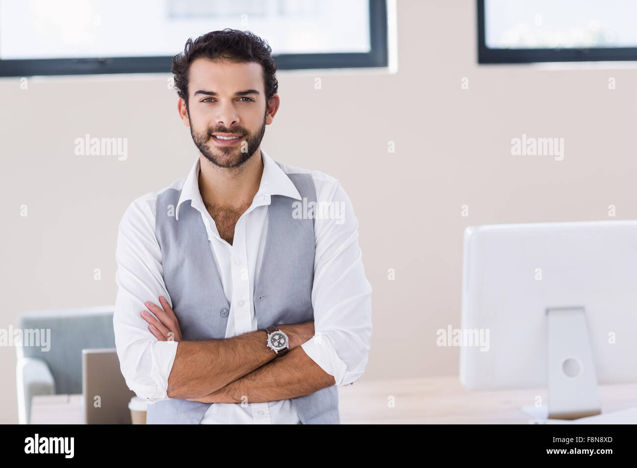 Portrait of smiling man with arms crossed Stock Photo - Alamy