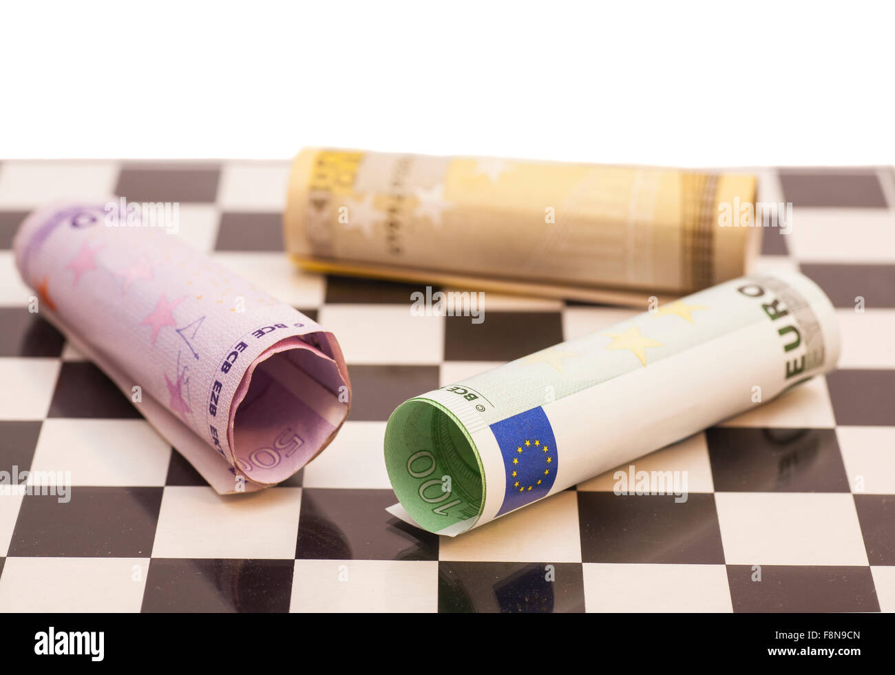 Euro banknotes on chess board Stock Photo - Alamy