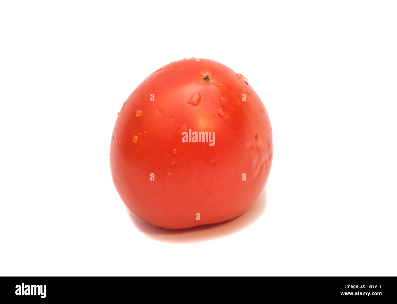 Tomato with drops isolated on white background Stock Photo - Alamy