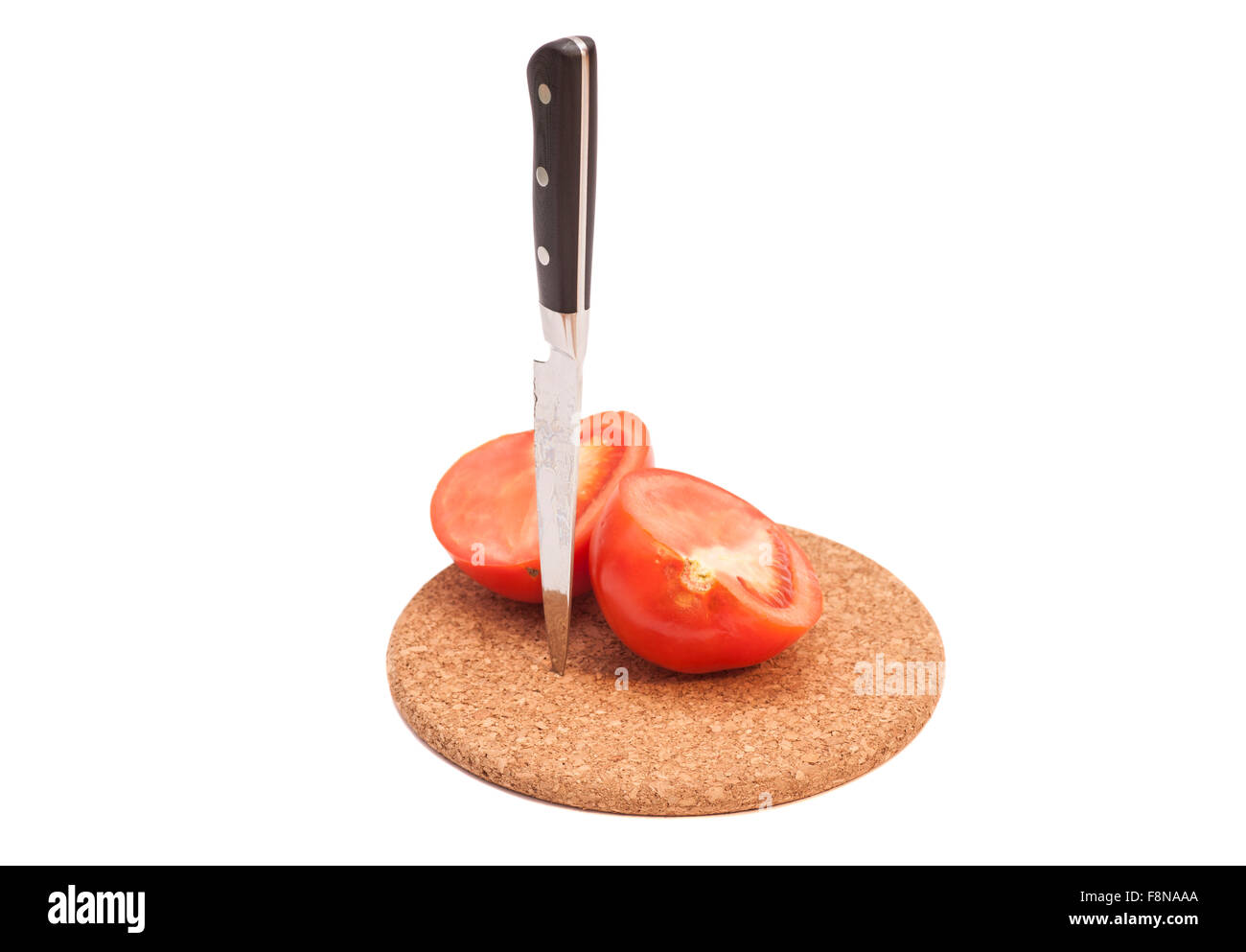 Tomatoes and knife on board isolated on white Stock Photo - Alamy