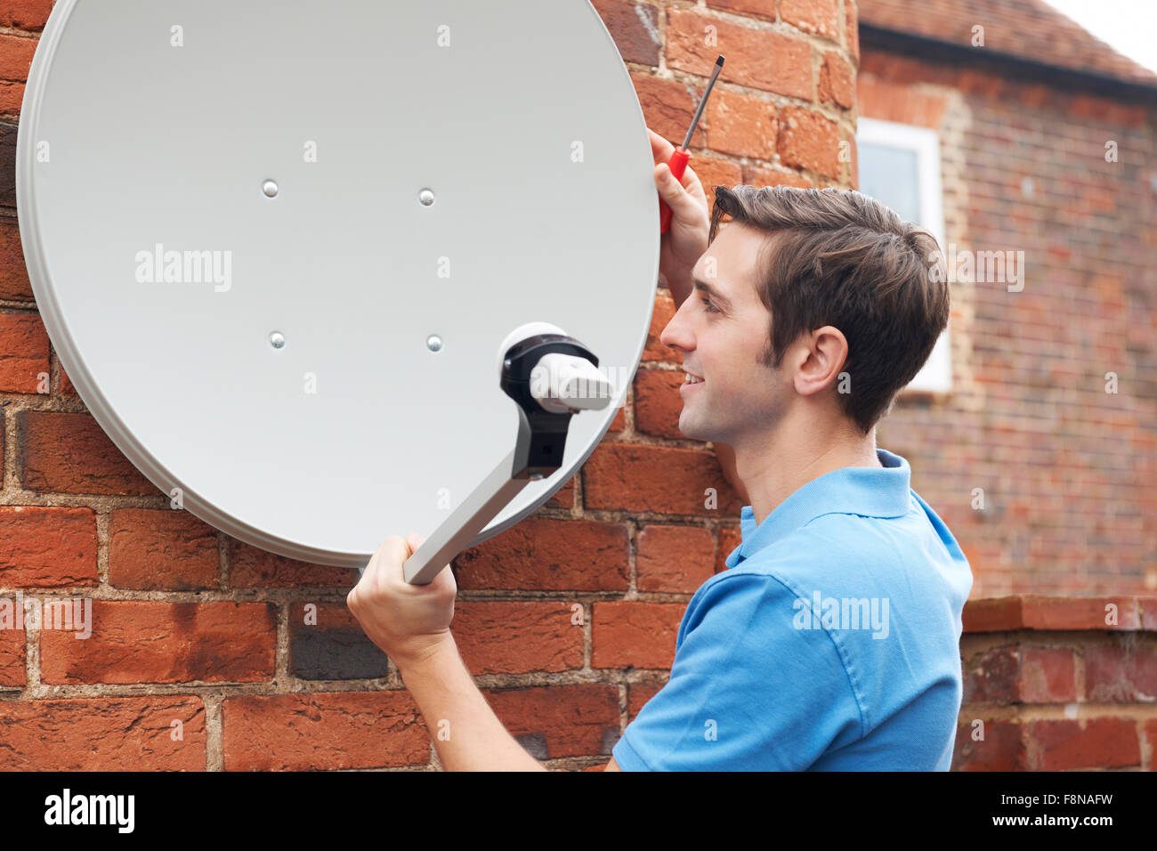 Installing satellite dish hires stock photography and images Alamy