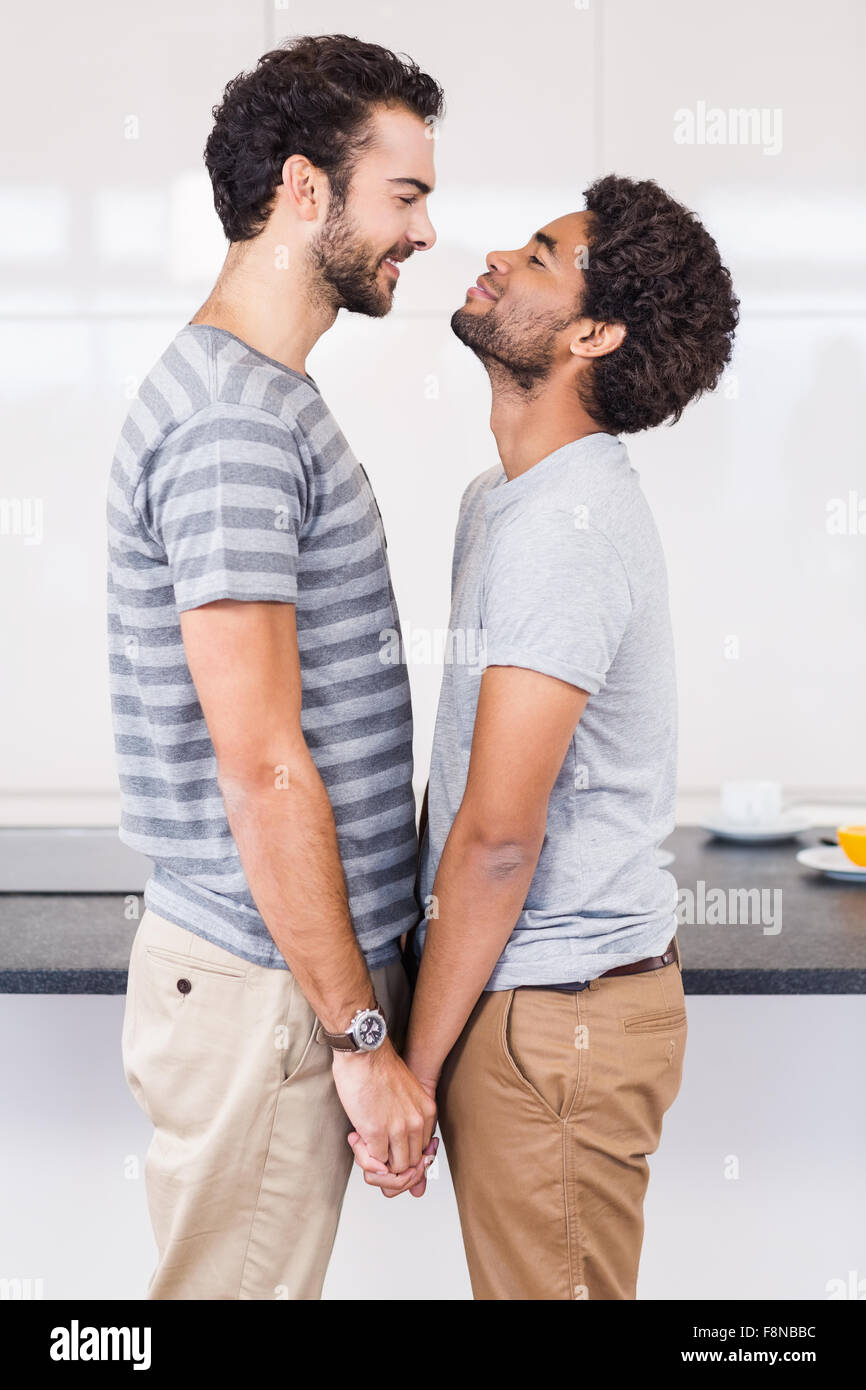 Happy gay couple holding their hands Stock Photo