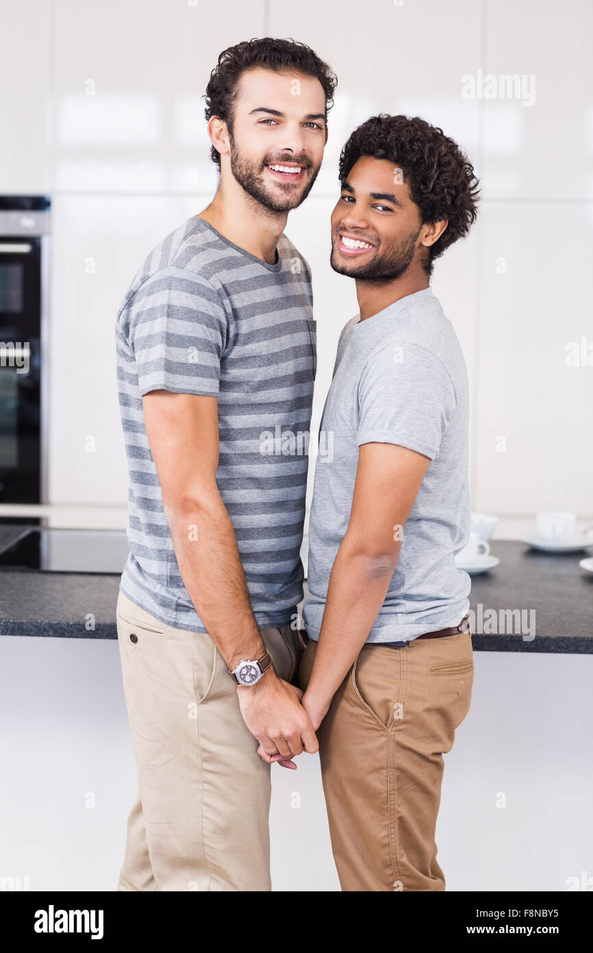 Happy gay couple holding their hands Stock Photo