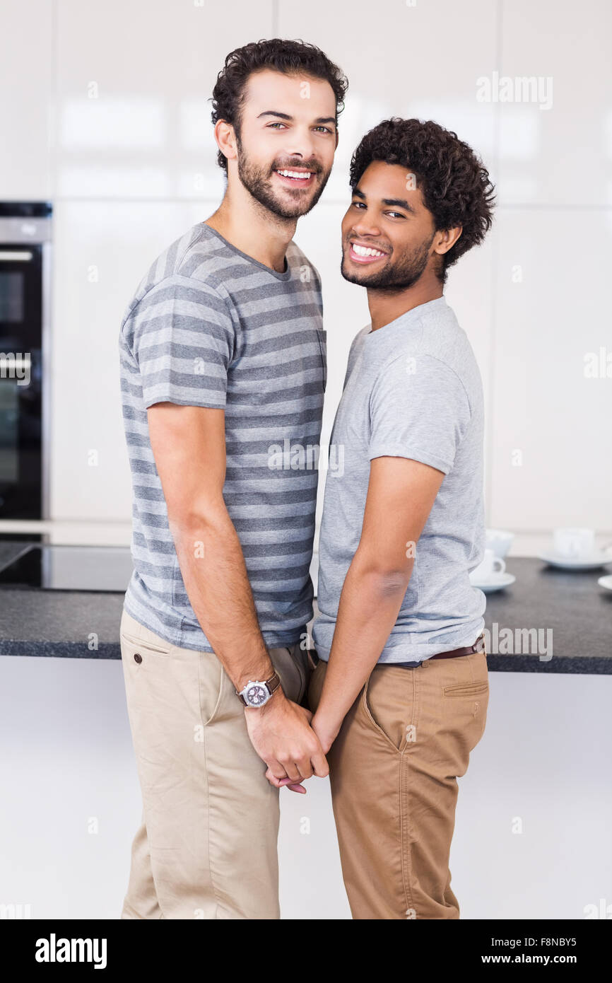 Happy gay couple holding their hands Stock Photo - Alamy