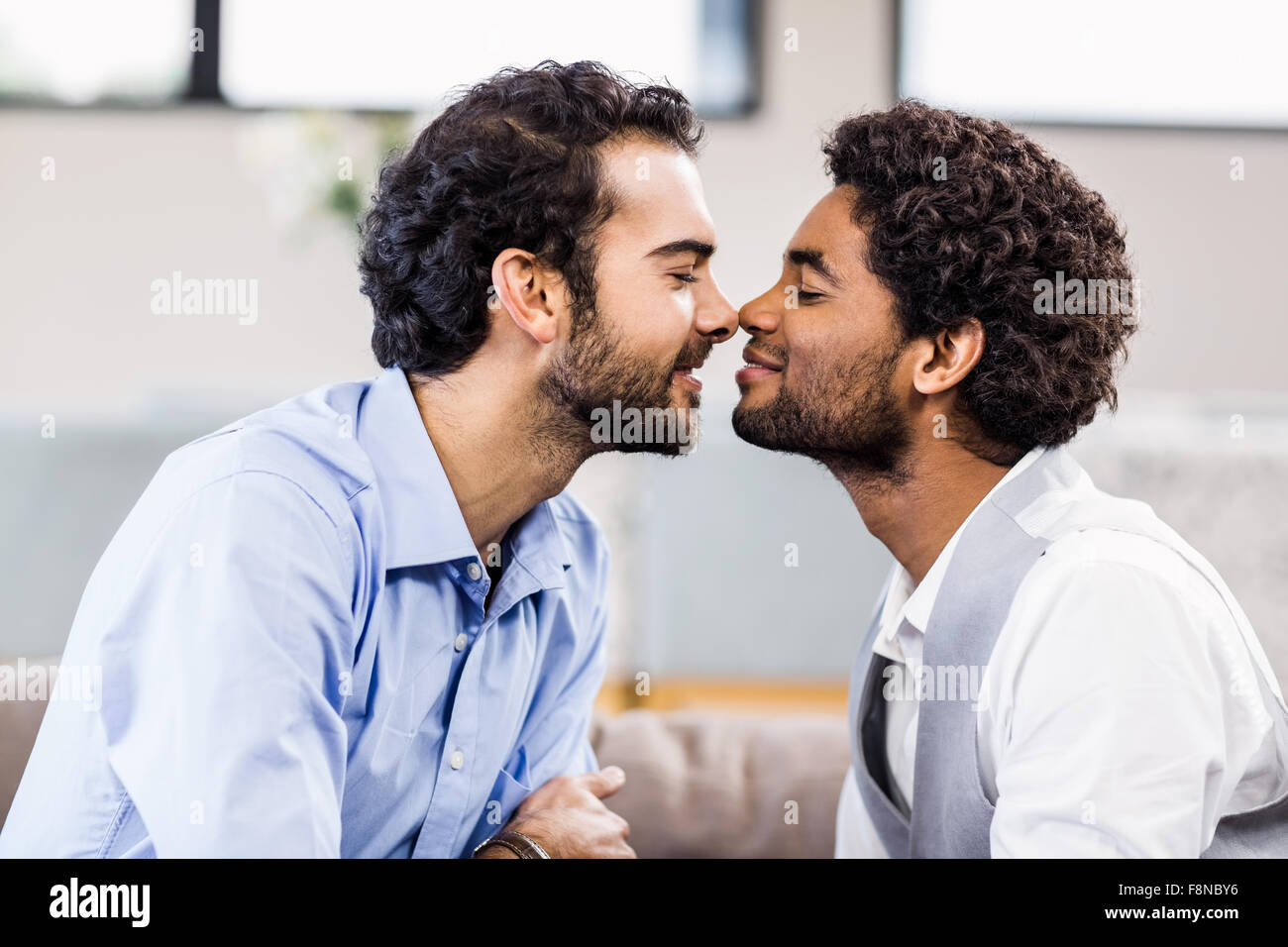 Happy gay couple nosetonose Stock Photo Alamy