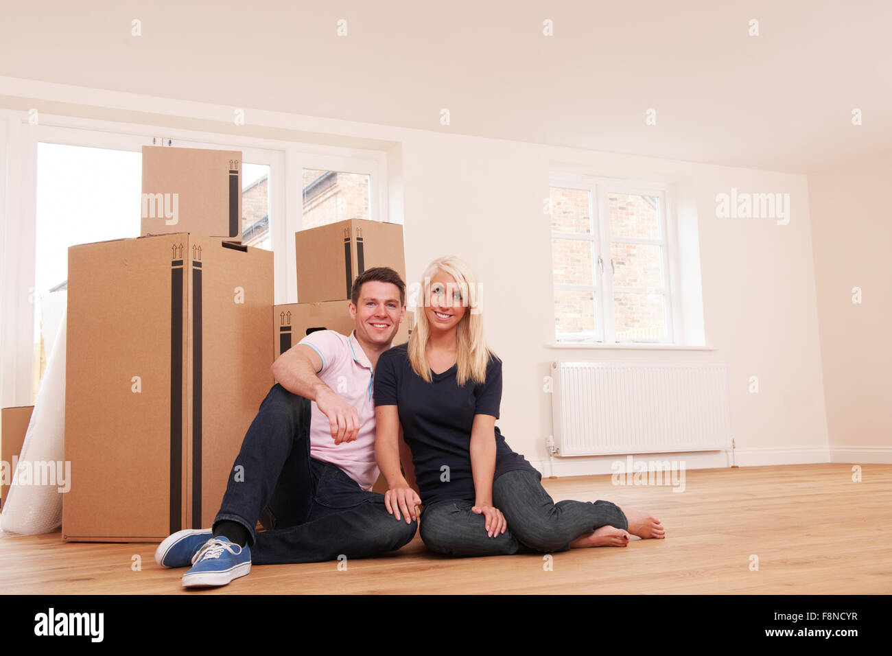 Couple Moving Into New Home Together Stock Photo - Alamy