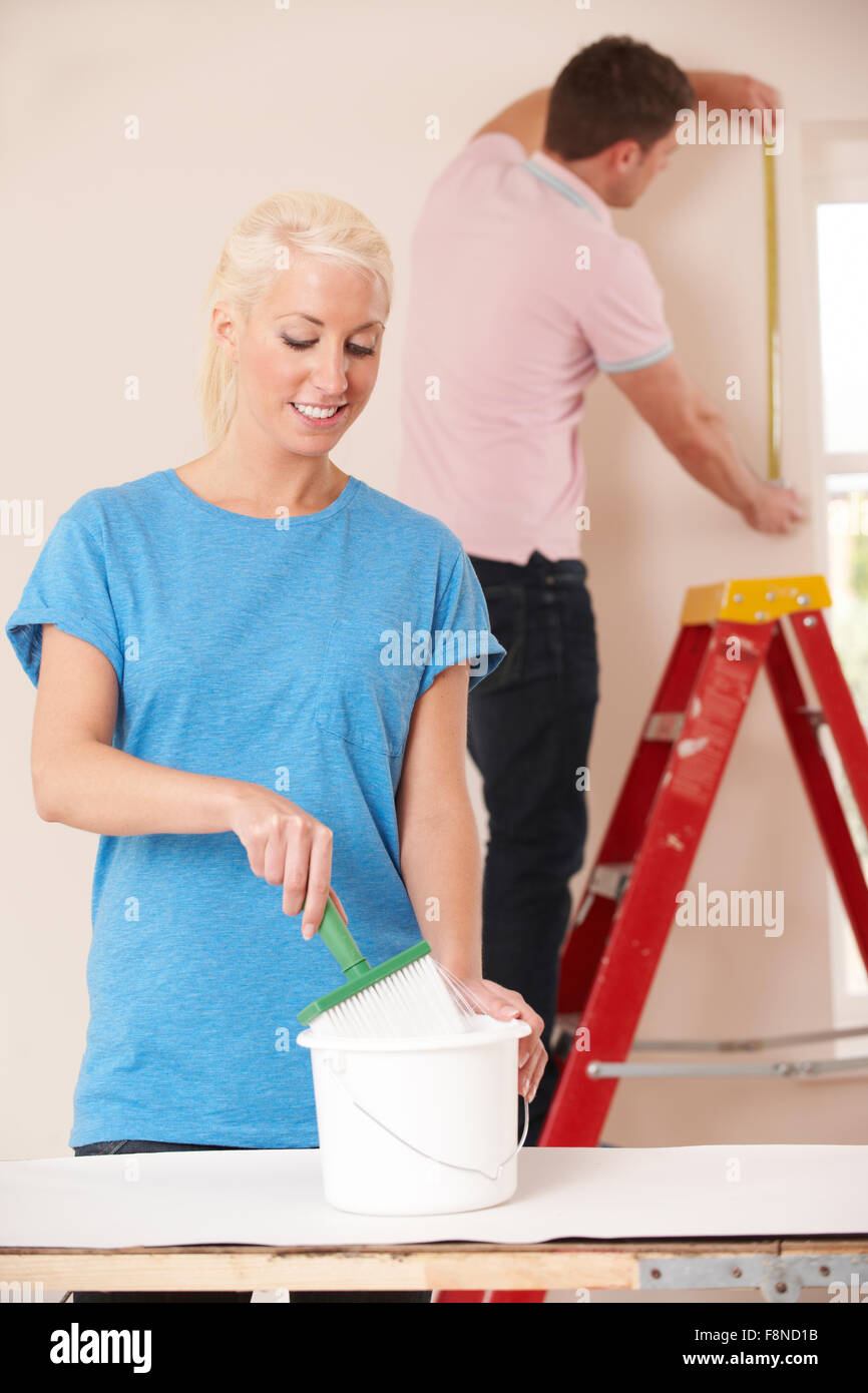 Young Couple Decorating Home Together Stock Photo Alamy