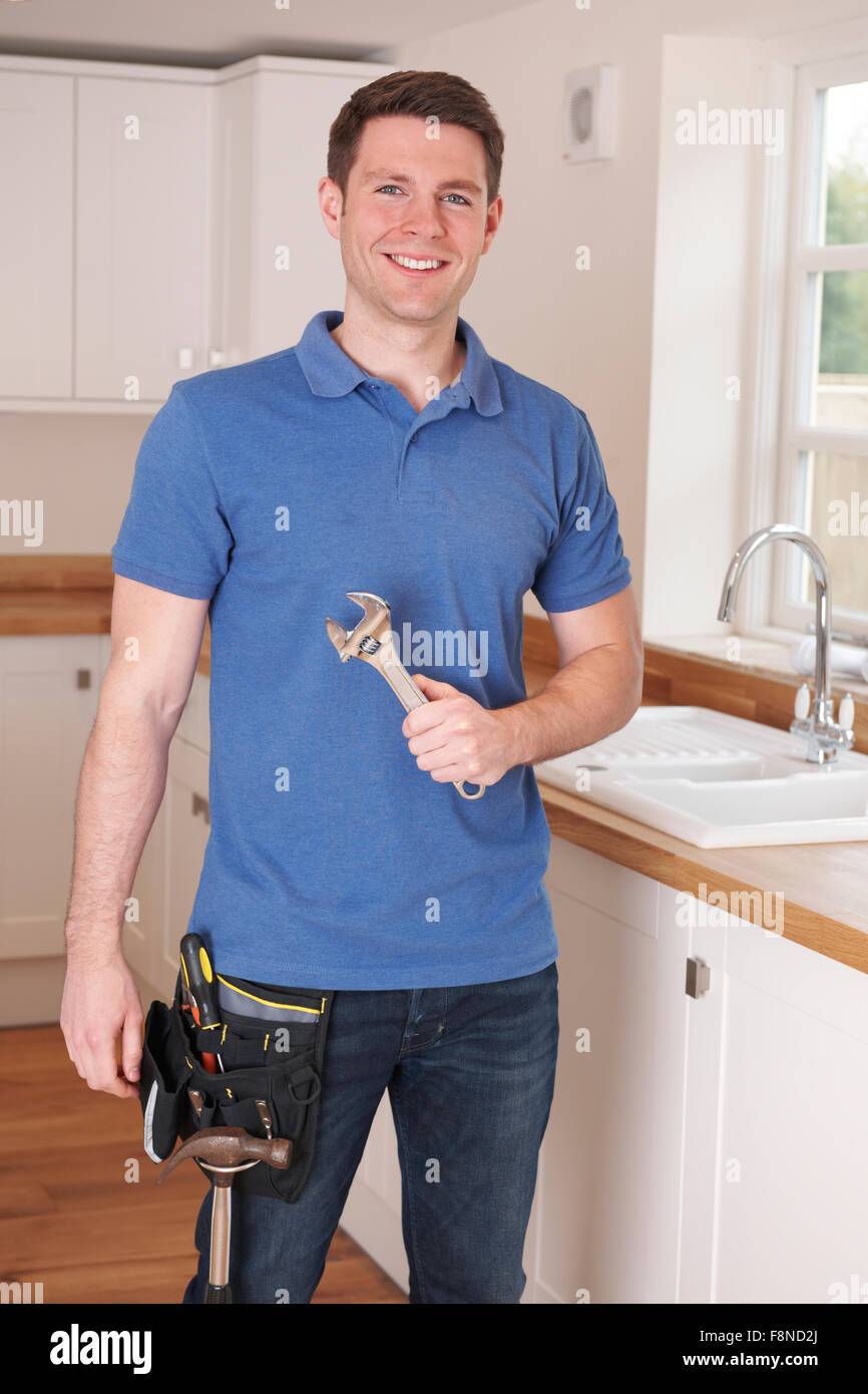 Plumber Mending Tap With Adjustable Wrench Stock Photo