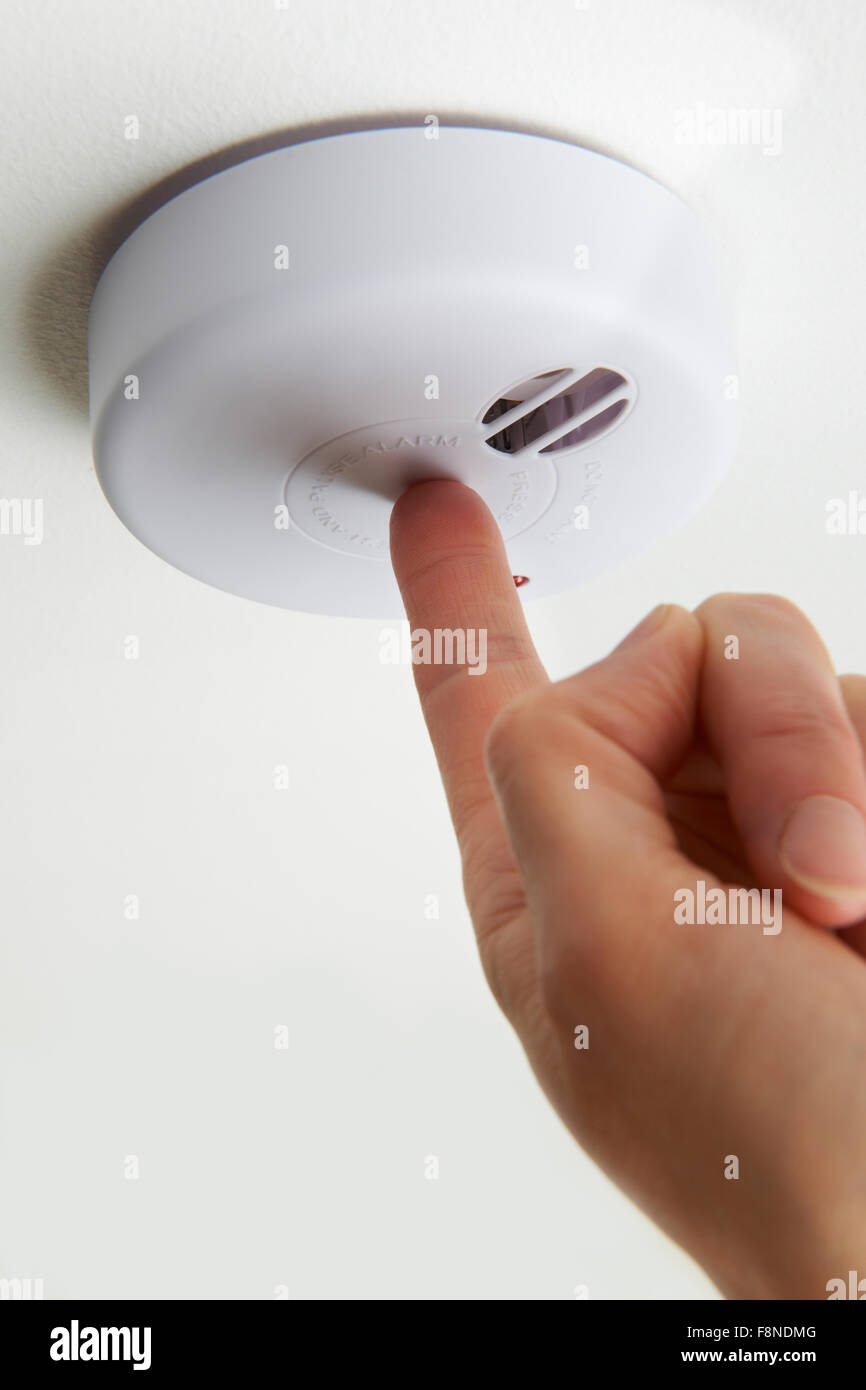 Woman smoke alarm hi-res stock photography and images - Alamy