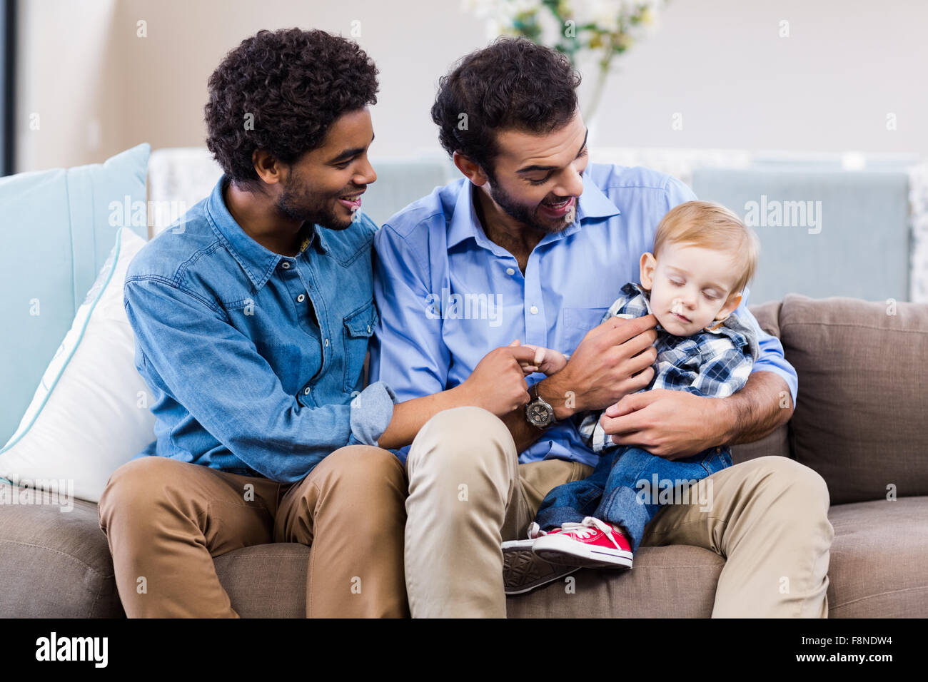 Happy gay couple with child Stock Photo