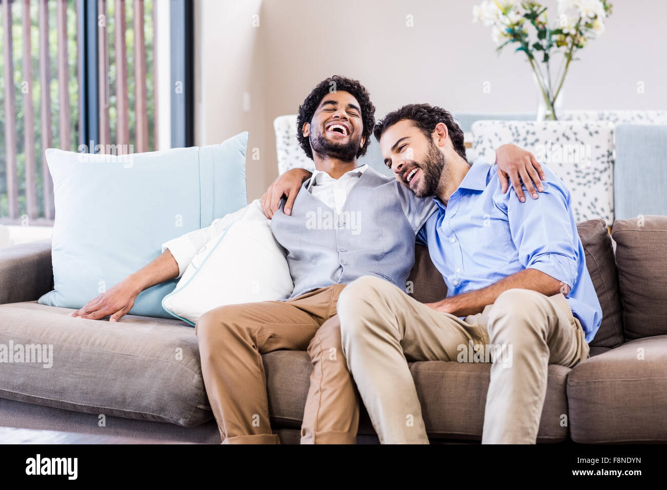 Happy gay couple laughing Stock Photo