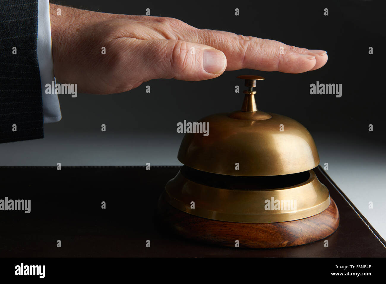 Businessman Ringing On Service Bell Stock Photo Alamy