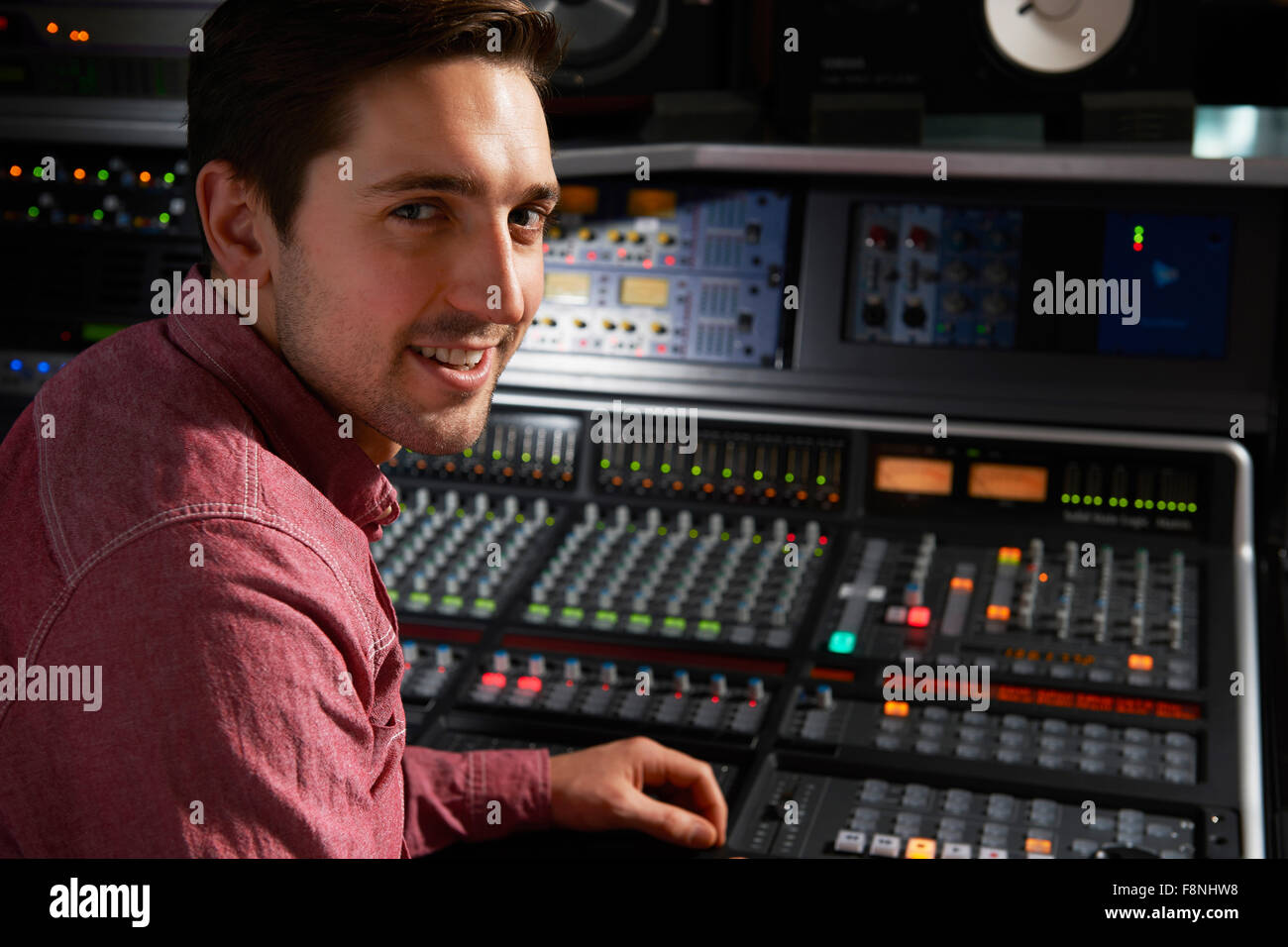 Engineer Working At Mixing Desk In Recording Studio Stock Photo Alamy
