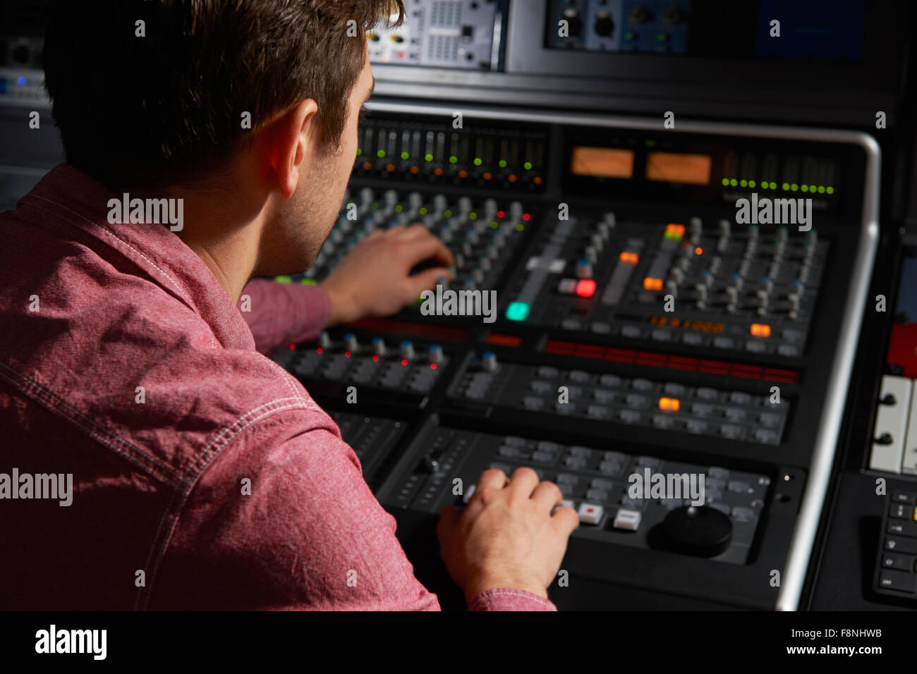 Engineer Working At Mixing Desk In Recording Studio Stock Photo Alamy