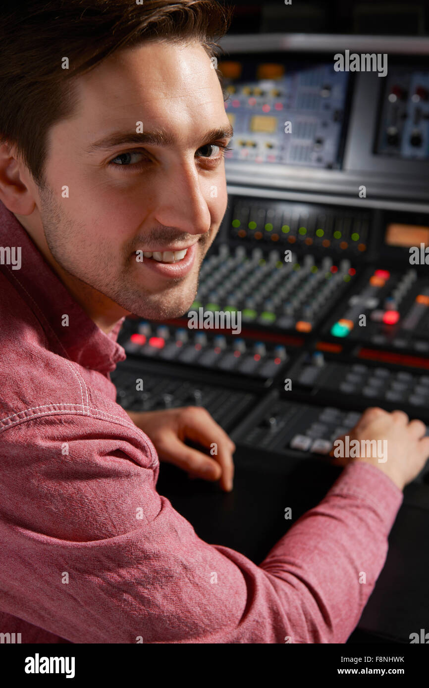 Engineer Working At Mixing Desk In Recording Studio Stock Photo Alamy