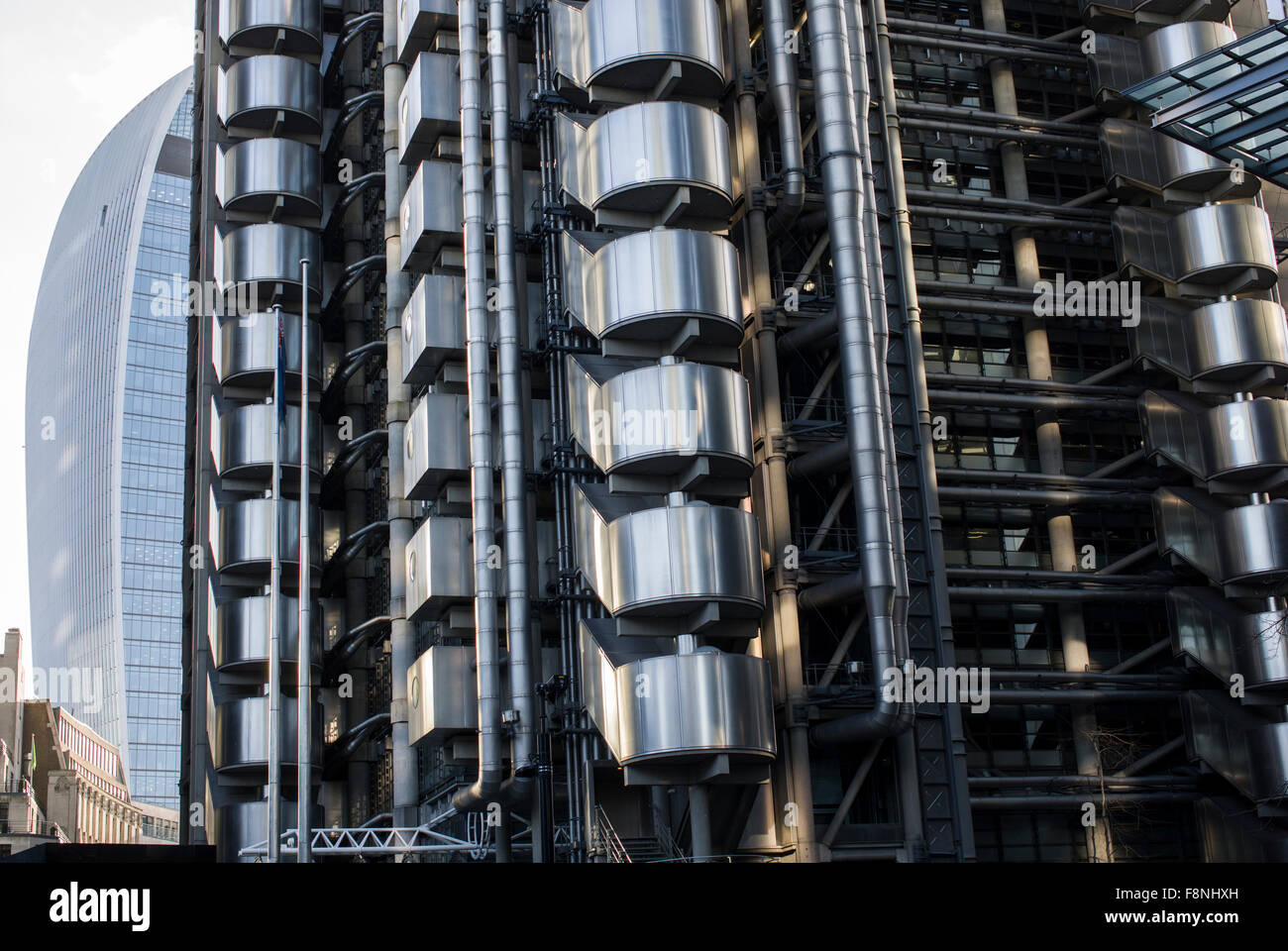 The walkie-talkie building in Central London at 20 Fenchurch Street with the Lloyds building aka Inside-Out building in the fore Stock Photo