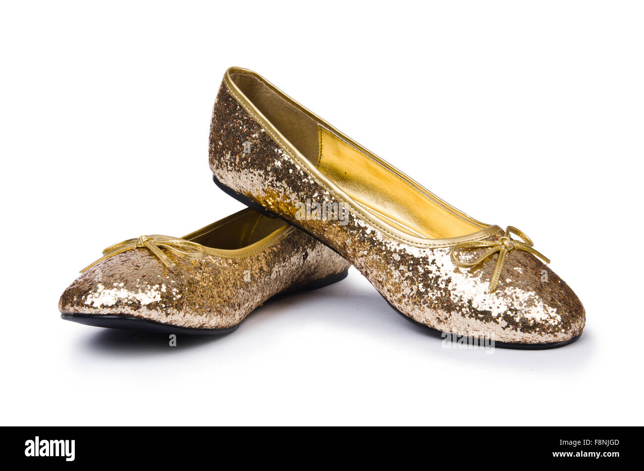 Golden ballet shoes isolated on white 