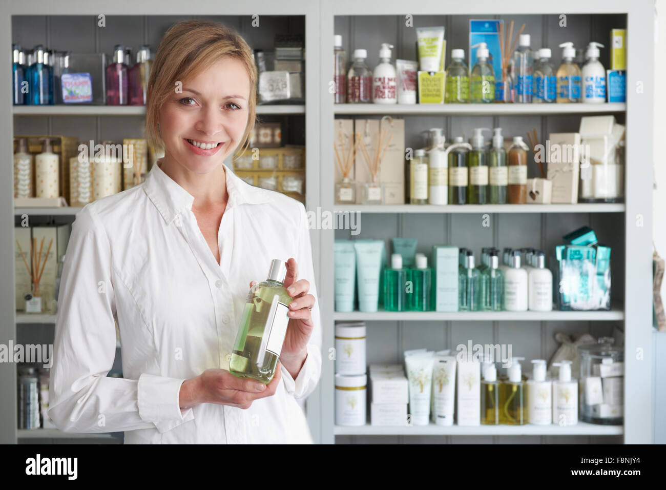 Beautician Advising On Beauty Products Stock Photo