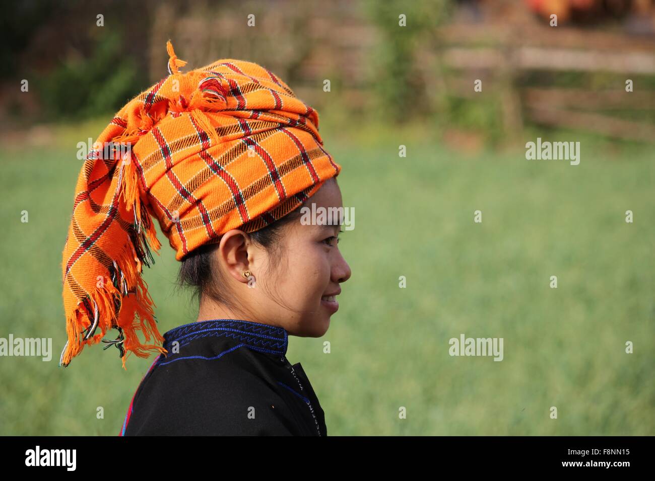 Typical girl from Shan State in Myanmar. The orangey, red headscarfs are worn by women of the Pa-O ethnic group. The Pa’O people Stock Photo