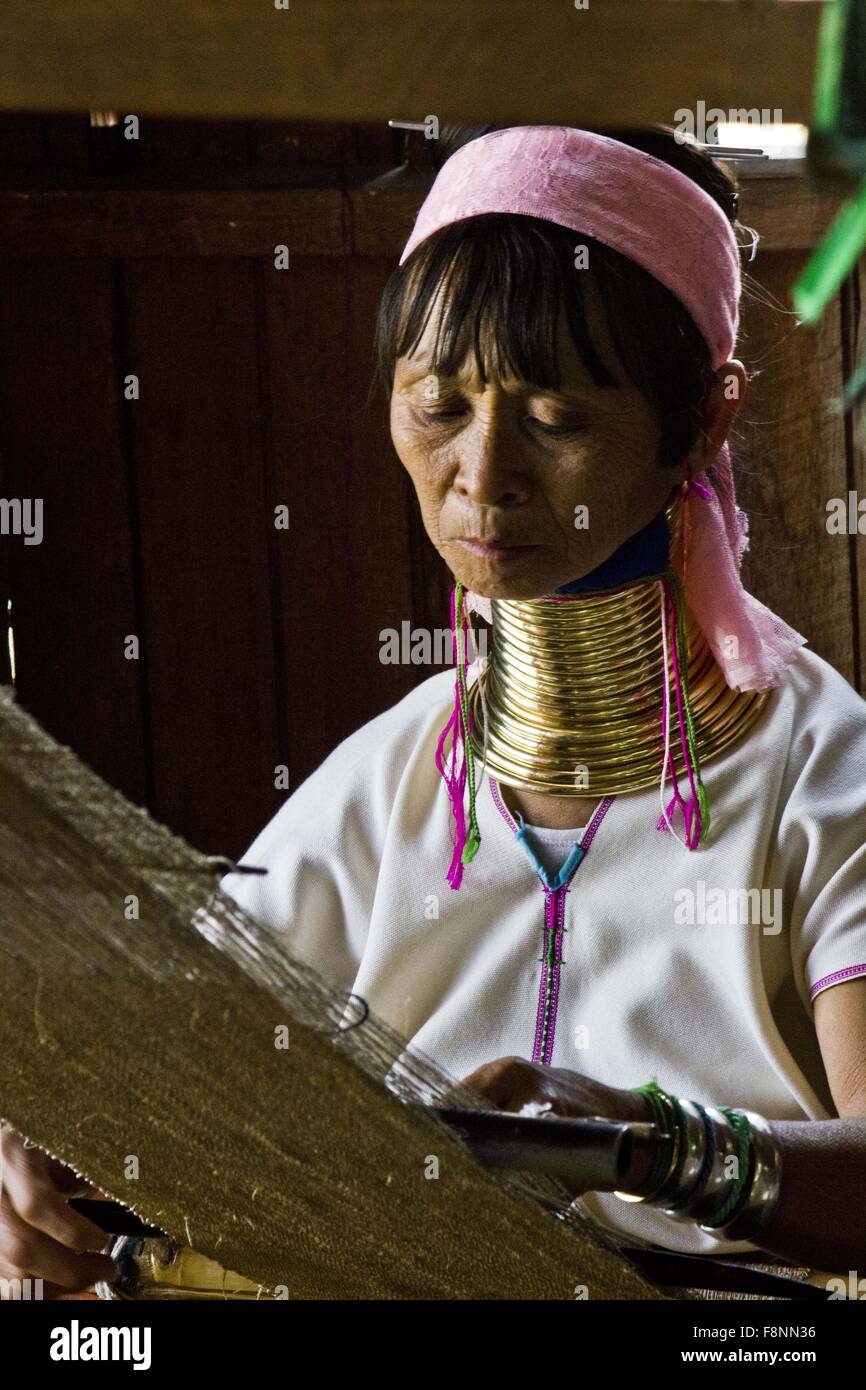 The Kayan women wear brass coils around their necks to give the